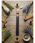 Incense sticks with lavender, rosemary, and other herbs on a wooden surface